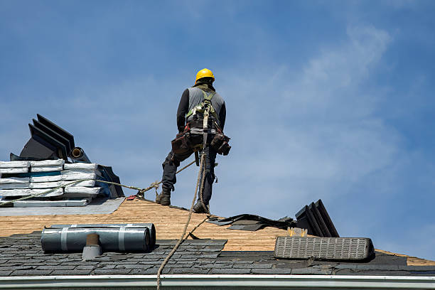 Professional Gutter Installation technician working in Roxbury, MA